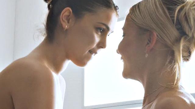 Tattooed lesbians massage and finger each other's pussies in oil while kissing and licking each other's brown hairless pussies