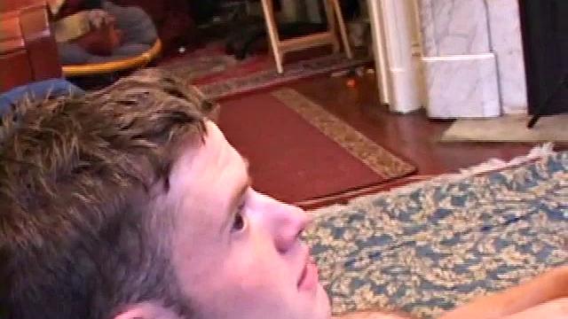 Nate Ritchie strokes his cock to full mast, his eyes glued to the porn video playing. He strokes lying down, standing up, before deciding the best way to unload is upside down.