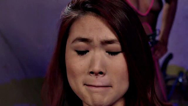 Whipped Asian lez with buttplug licks Ebony pussy