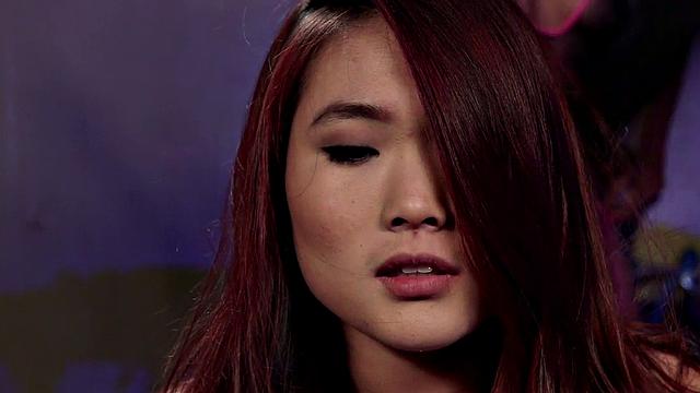 Whipped Asian lez with buttplug licks Ebony pussy