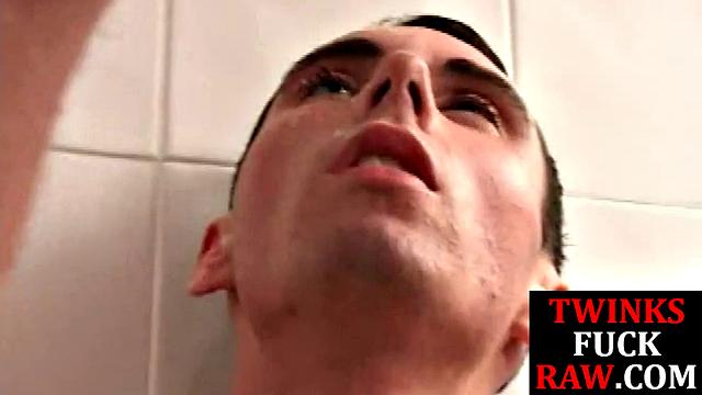 Cock tugged twink barebacked by top in shower