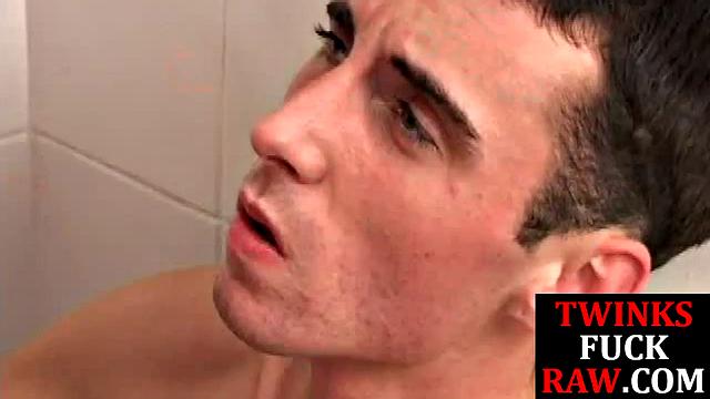 Cock tugged twink barebacked by top in shower