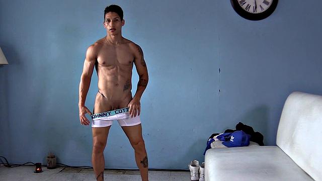 Ronaldo is a sexy and buffed Latin jock, and we have the pleasure of watching as he slowly strips naked and flexes his muscles. Standing, the inked young man gets busy working up a boner.