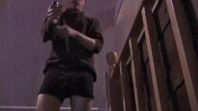 By the time the camera finds him, Dan is already going for his woody. He seems uncomfortable in the chair, so he stands up and moves to the staircase, where we can see his cock getting harder and harder.