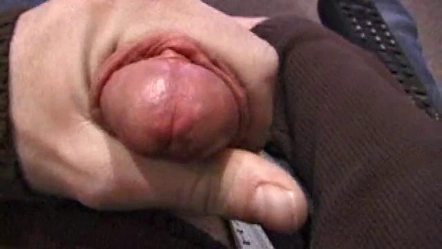 By the time the camera finds him, Dan is already going for his woody. He seems uncomfortable in the chair, so he stands up and moves to the staircase, where we can see his cock getting harder and harder.