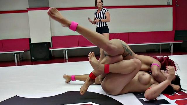 Redhead pigtailed wrestling fights Asian rival on mat