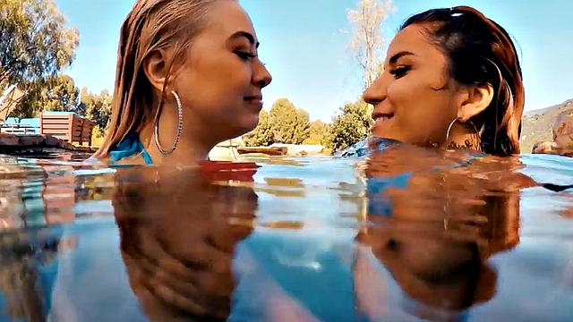 Heavy breasted dykes scissoring on swimming pool outdoor