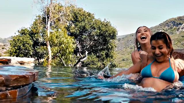 Heavy breasted dykes scissoring on swimming pool outdoor