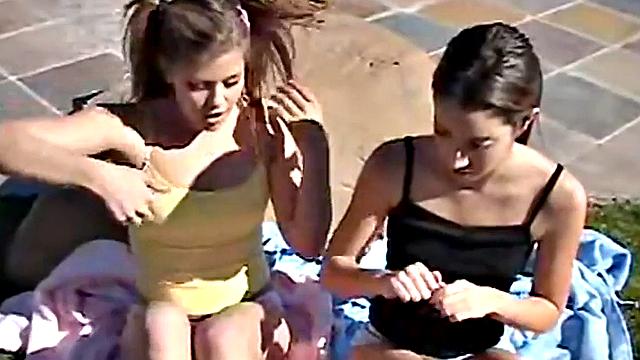 Brunette and skinny teen babes get off by kissing and playing with each other's small tits in the pool