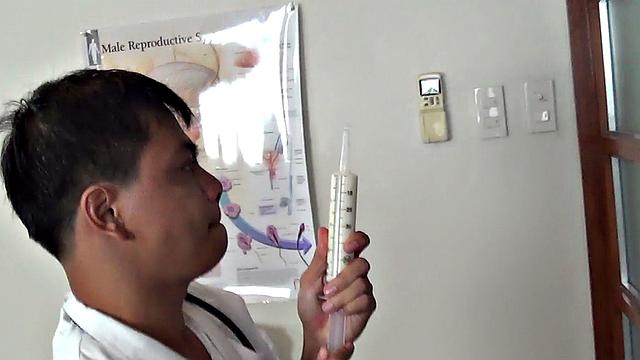 Real Asian twink gets an enema in doctor's office after anal gaping