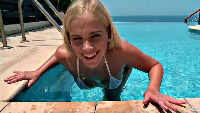 Blonde with small tits gets wet and wild with outdoor pool fingering and poolside masturbation