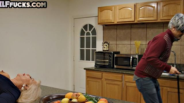 Classy granny in lingerie fucked by stud in kitchen