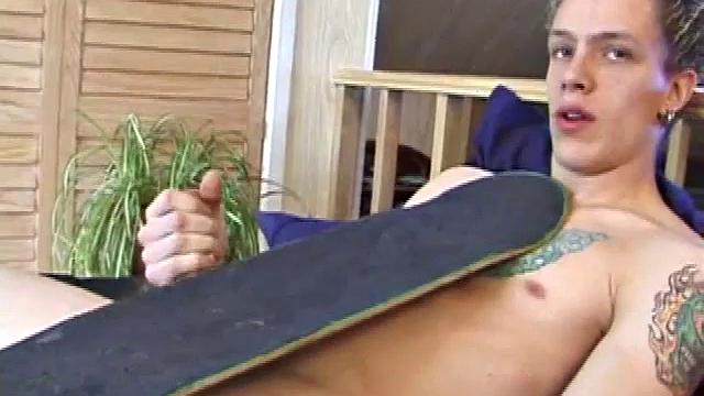 After returning from skateboarding, Shane strips down and starts tugging on his cock. Following some serious stroking, Shane cums all over his skateboard.