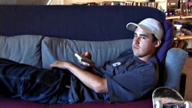 This 21 year old skater boy leans back on a sofa and rubs his bulge through some pretty heavy jeans and then, after unzipping, through the fly of his boxers. Getting stiffer, Mark shows off his nice boner while staring into the camera.