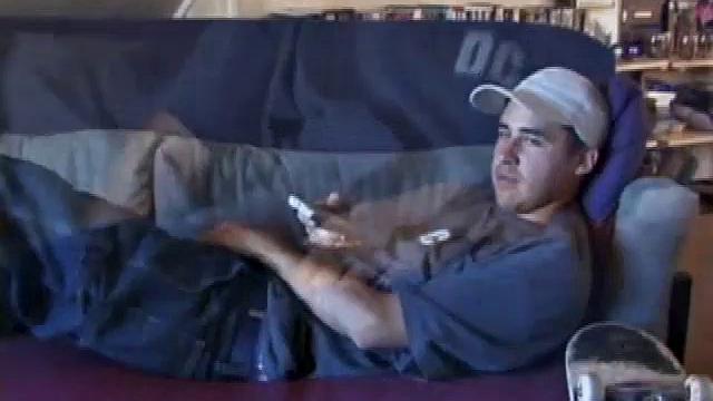 This 21 year old skater boy leans back on a sofa and rubs his bulge through some pretty heavy jeans and then, after unzipping, through the fly of his boxers. Getting stiffer, Mark shows off his nice boner while staring into the camera.