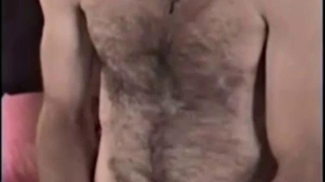 Rugged and good looking Tim gets a visit from hairy and well hung Larry. It doesn't take long and these two are naked, getting it on.