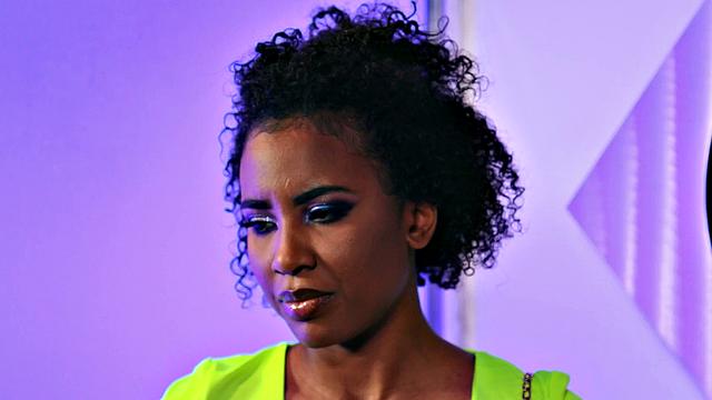 Curly-haired babe in red lingerie enjoys threesome action in bedroom