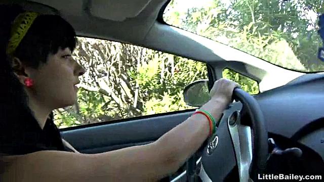 Little Bailey choking on a dildo while she masturbates