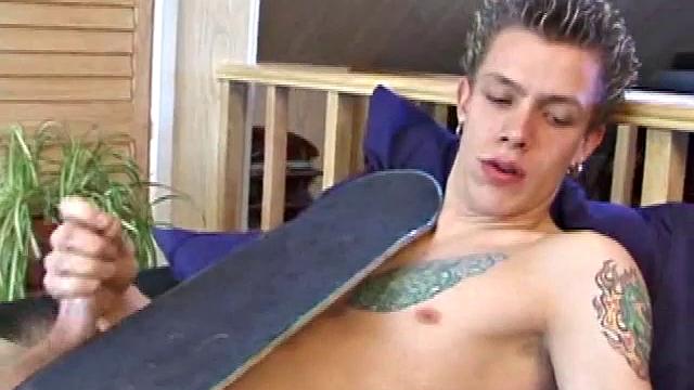 After returning from skateboarding, Shane strips down and starts tugging on his cock. Following some serious stroking, Shane cums all over his skateboard.