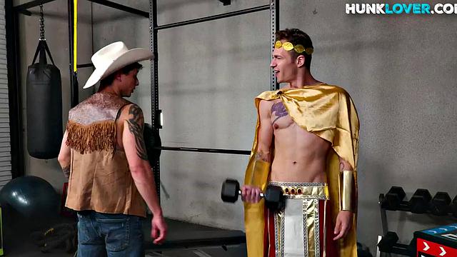 Cowboy with tattoos fucks cosplay bottom in gym