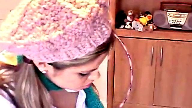 A kinky amateur tease herself in a steamy solo scene with long socks, toys, and a bald pussy