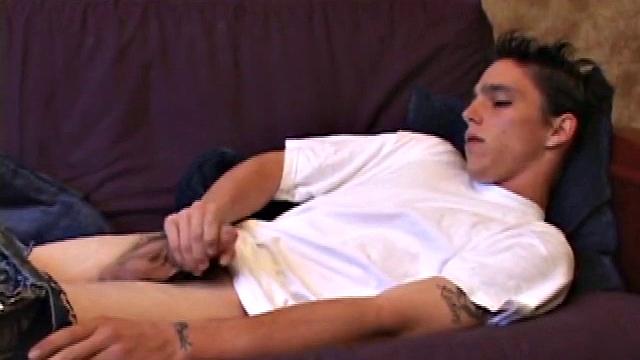 When young Sean Cage unzips his pants, he pulls out his stiff cock and goes to work on it. He gives himself a little head and then inserts sex toys up his ass, before stroking out a warm cum load onto his tummy.