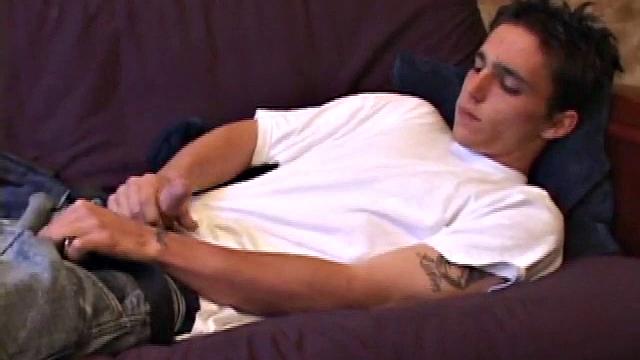 When young Sean Cage unzips his pants, he pulls out his stiff cock and goes to work on it. He gives himself a little head and then inserts sex toys up his ass, before stroking out a warm cum load onto his tummy.