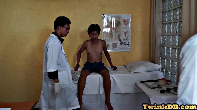 Asian doctors examining twink's butt