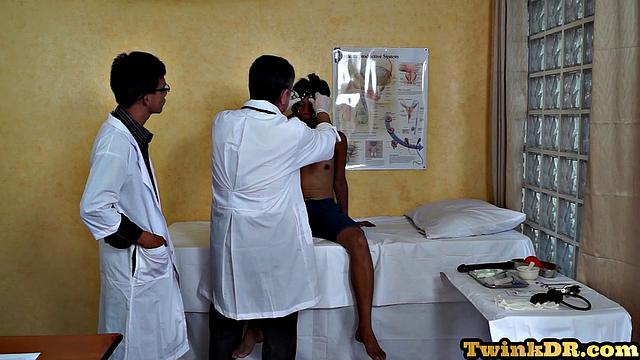 Asian doctors examining twink's butt