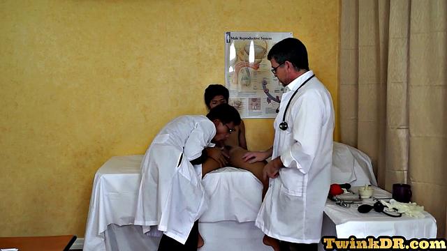 Asian doctors examining twink's butt