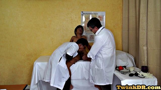 Asian doctors examining twink's butt
