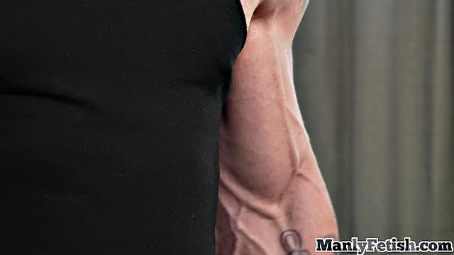 Muscled jock gets handjob by ebony 