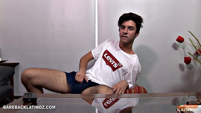 Our featured solo of the week is boy next door Marcuccio. Wearing shorts and a t-shirt, the young Latino is in the living room and wastes no time reaching for his package.