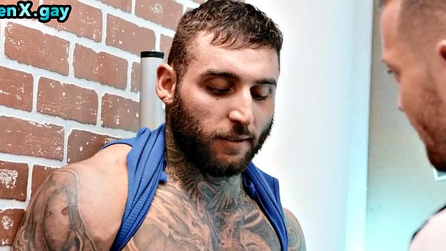 Manly jock with muscled inked body fucks policeman in the toilet