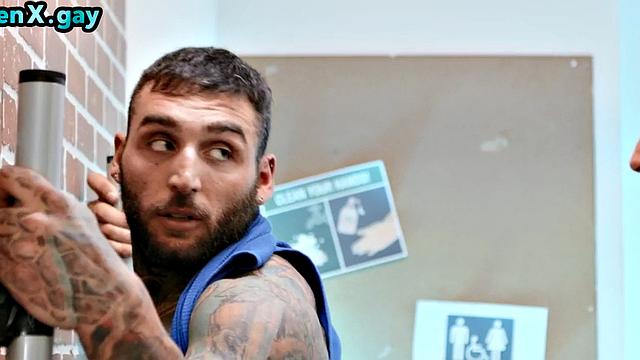 Manly jock with muscled inked body fucks policeman in the toilet