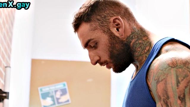 Manly jock with muscled inked body fucks policeman in the toilet