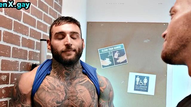 Manly jock with muscled inked body fucks policeman in the toilet
