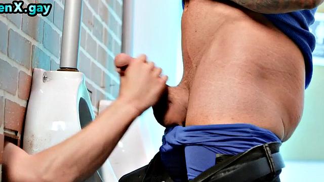 Manly jock with muscled inked body fucks policeman in the toilet