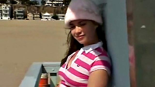 Little April fingering her tight brown hair-free pussy in the car