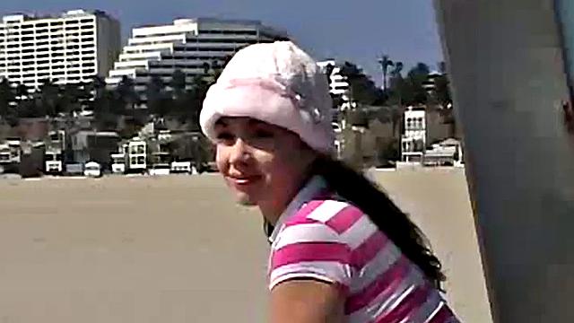 Little April fingering her tight brown hair-free pussy in the car