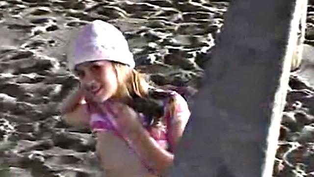 Little April fingering her tight brown hair-free pussy in the car