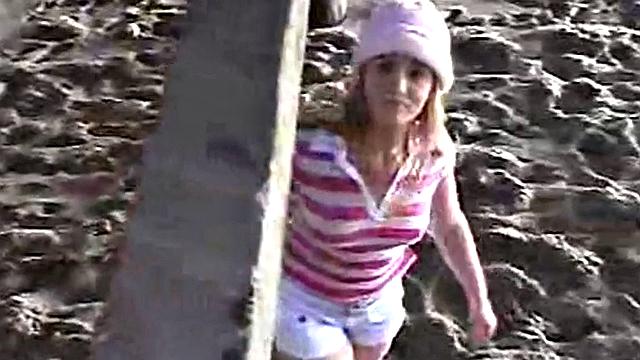 Little April fingering her tight brown hair-free pussy in the car