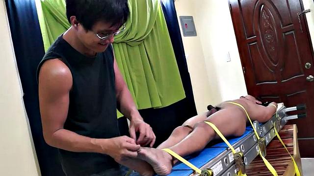 We just can't get enough of gorgeous Gil! We brought him back for some tickle fun, and this time we strapped him on our tickle rack.