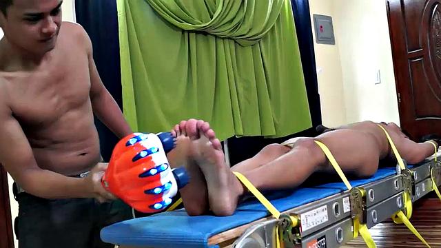 We just can't get enough of gorgeous Gil! We brought him back for some tickle fun, and this time we strapped him on our tickle rack.