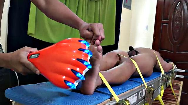 We just can't get enough of gorgeous Gil! We brought him back for some tickle fun, and this time we strapped him on our tickle rack.