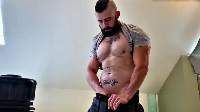 Bearded hunk fingering butthole for cumshot