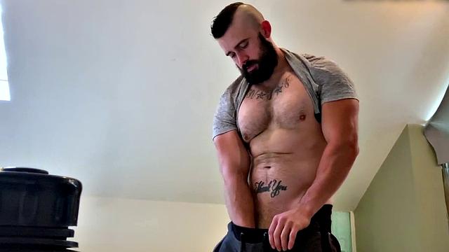 Bearded hunk fingering butthole for cumshot