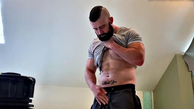 Bearded hunk fingering butthole for cumshot