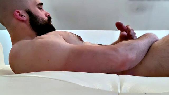 Bearded hunk fingering butthole for cumshot