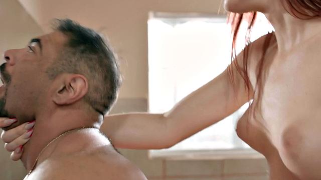 Redhead TS with big boobs barebacks man in bathroom